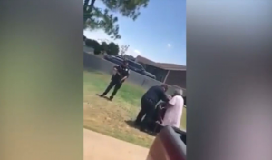 Read more about the article Watch: Black Texas Man’s Grandmother Stands Between Him and Gun-Wielding Police Officers…All Because He Reportedly Ran a Stop Sign