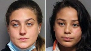Read more about the article 2 women charged with hate crimes for snatching MAGA hat from Trump supporters