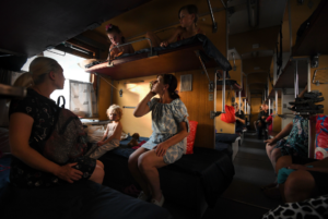 Read more about the article Riding Ukraine’s last train line out of Donbas with families fleeing for their lives