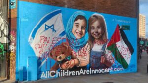 Read more about the article Israel-Gaza: Defaced peace mural is painted black by TfL