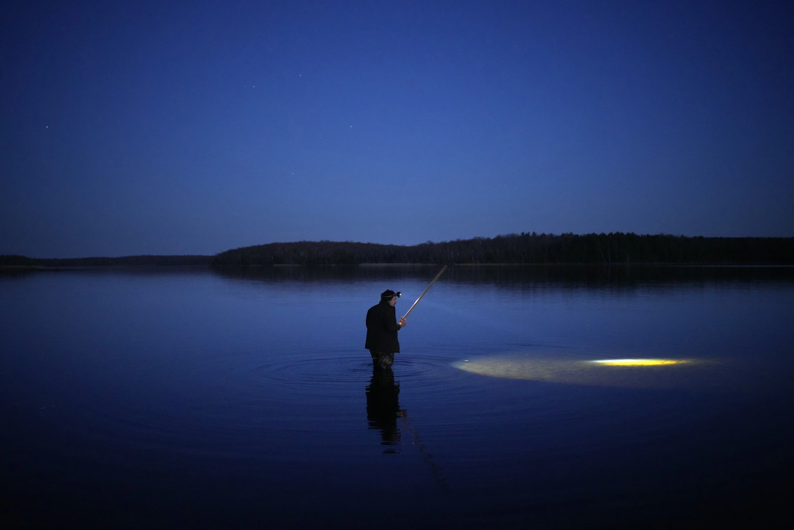 You are currently viewing As climate change alters lakes, tribes and conservationists fight for the future of spearfishing