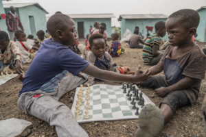 Read more about the article A chess club for kids thrives in a Congo refugee camp. It’s about more than the game