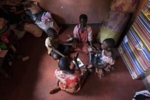 Read more about the article Many families in Uganda stuck with unhealthy dirt floors are finding an affordable alternative
